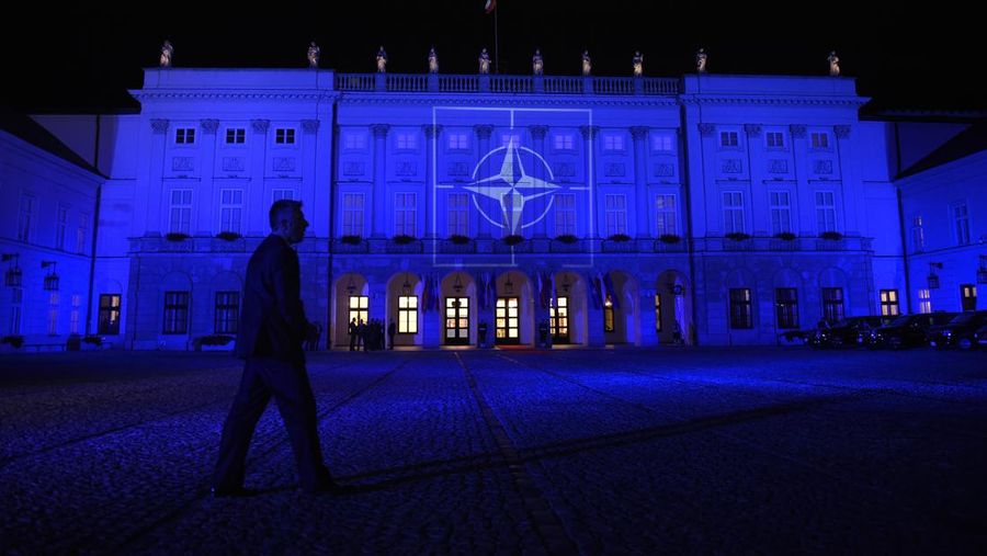 The Presidential Palace in Warsaw, Poland, Friday, July 8, 2016, is lit up with the NATO logo as leader are participating in a NATO working dinner. Obama is in Warsaw to attend the NATO Summit. (AP Photo/Susan Walsh)