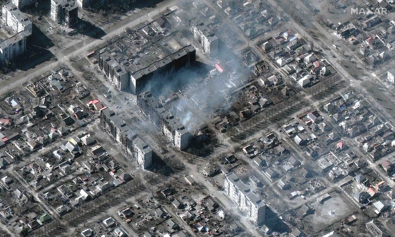 Russia Ukraine War This satellite image provided by Maxar Technologies shows burning buildings at Livoberezhnyi district in Mariupol, Ukraine Tuesday, March 22, 2022. (Satellite image ©2022 Maxar Technologies via AP)