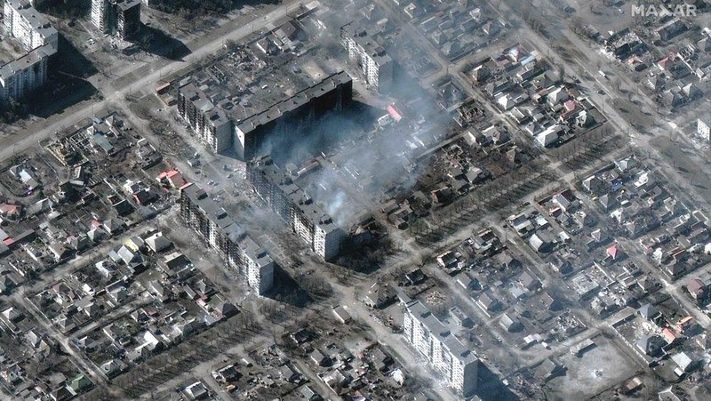 This satellite image provided by Maxar Technologies shows burning buildings at Livoberezhnyi district in Mariupol, Ukraine Tuesday, March 22, 2022. (Satellite image ©2022 Maxar Technologies via AP)
