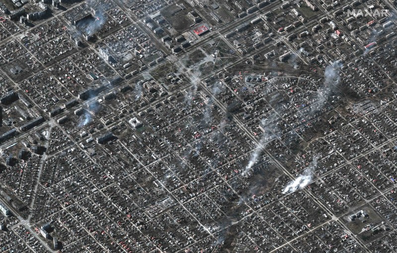 This satellite image provided by Maxar Technologies shows burning buildings at Livoberezhnyi district in Mariupol, Ukraine Tuesday, March 22, 2022. (Satellite image ©2022 Maxar Technologies via AP)