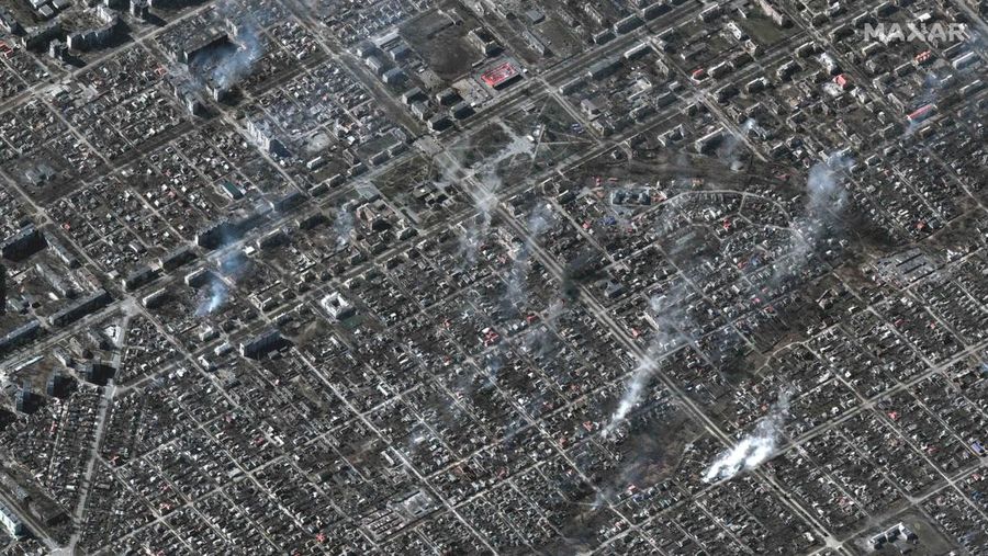 This satellite image provided by Maxar Technologies shows burning buildings at Livoberezhnyi district in Mariupol, Ukraine Tuesday, March 22, 2022. (Satellite image ©2022 Maxar Technologies via AP)