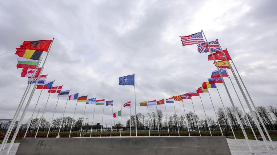 FILE - Flags of NATO member countries flap in the wind outside NATO headquarters in Brussels, Feb. 22, 2022. As Western leaders congratulate themselves for their speedy and severe responses to Russia’s invasion of Ukraine, they’re also scratching their heads with uncertainty about what their actions will accomplish. (AP Photo/Olivier Matthys, File)