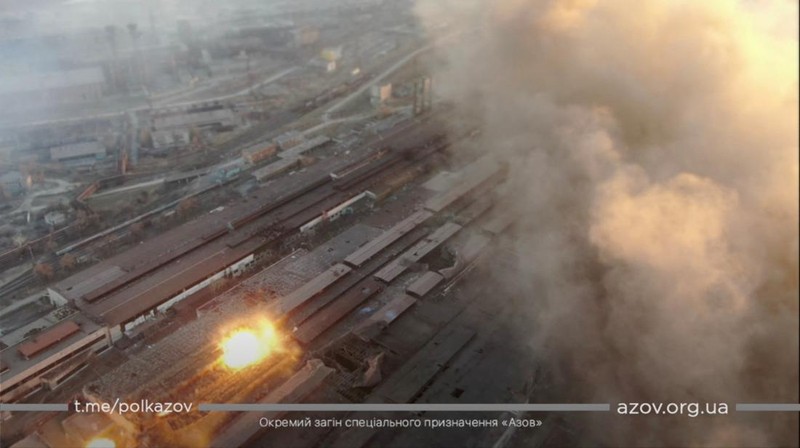 This satellite image provided by Maxar Technologies shows burning buildings at Livoberezhnyi district in Mariupol, Ukraine Tuesday, March 22, 2022. (Satellite image ©2022 Maxar Technologies via AP)