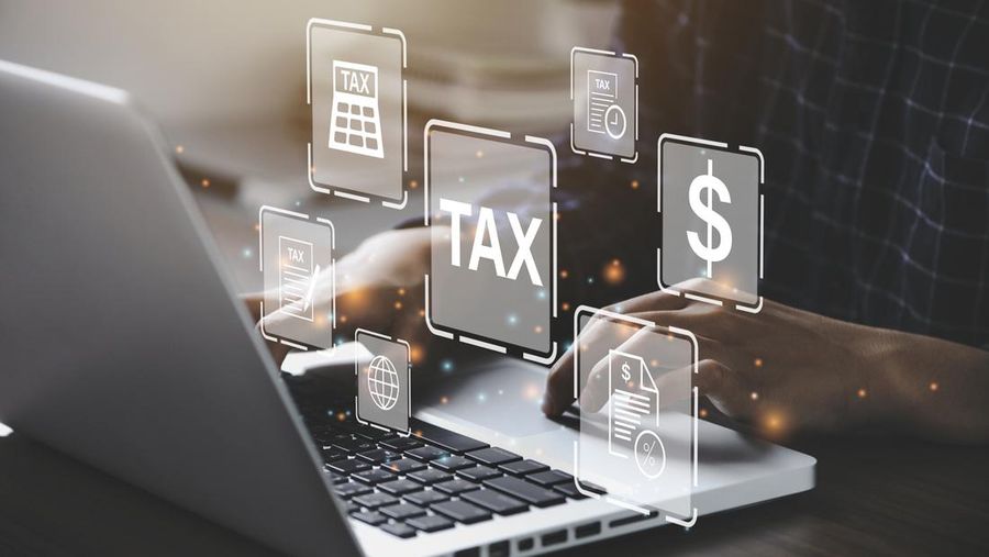 Busines using a computer to complete Individual income tax return form online for tax payment. Government, state taxes. Data analysis, paperwork, financial research, report. Calculation tax return.
