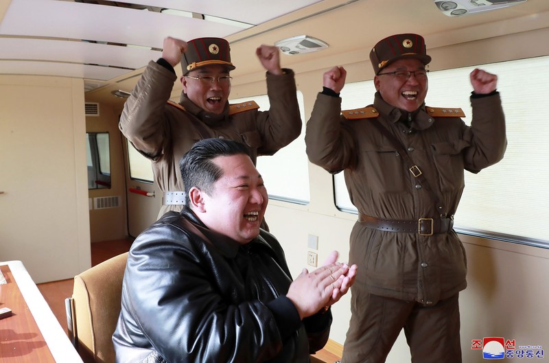 North Korea Koreas Tensions In this photo distributed by the North Korean government, North Korean leader Kim Jong Un, center, walks around what it says a Hwasong-17 intercontinental ballistic missile (ICBM) on the launcher, at an undisclosed location in North Korea on March 24, 2022. Independent journalists were not given access to cover the event depicted in this image distributed by the North Korean government. The content of this image is as provided and cannot be independently verified. Korean language watermark on image as provided by source reads: