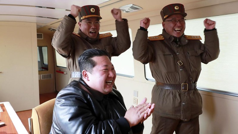 In this photo distributed by the North Korean government, North Korean leader Kim Jong Un, center, walks around what it says a Hwasong-17 intercontinental ballistic missile (ICBM) on the launcher, at an undisclosed location in North Korea on March 24, 2022. Independent journalists were not given access to cover the event depicted in this image distributed by the North Korean government. The content of this image is as provided and cannot be independently verified. Korean language watermark on image as provided by source reads: 