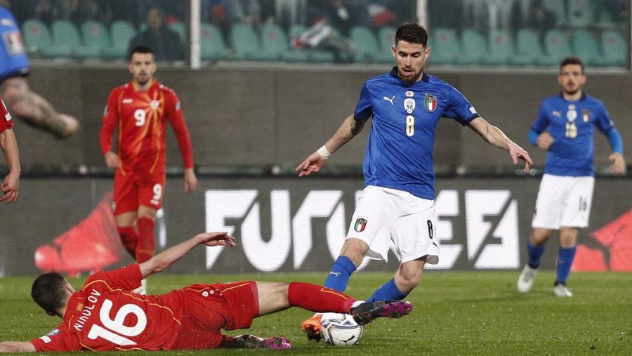 North Macedonia players celebrate as Italy's Alessandro Bastoni reacts after his team's got eliminated at the end of the World Cup qualifying play-off soccer match between Italy and North Macedonia, at Renzo Barbera stadium, in Palermo, Italy, Thursday, March 24, 2022. North Macedonia won 1-0. (AP Photo/Antonio Calanni)