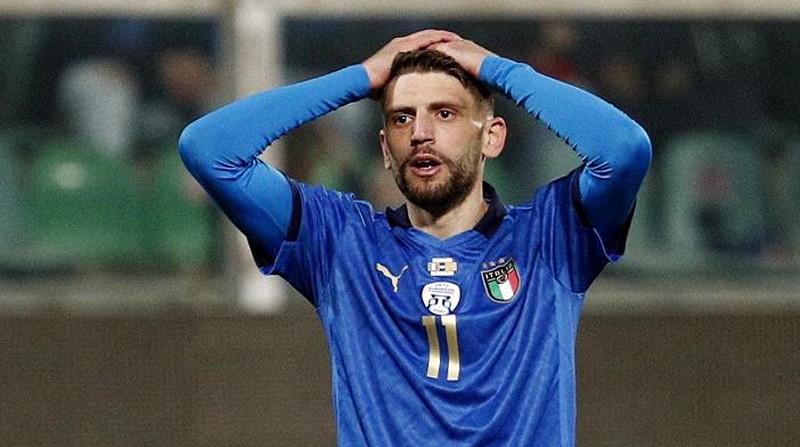 North Macedonia players celebrate as Italy's Alessandro Bastoni reacts after his team's got eliminated at the end of the World Cup qualifying play-off soccer match between Italy and North Macedonia, at Renzo Barbera stadium, in Palermo, Italy, Thursday, March 24, 2022. North Macedonia won 1-0. (AP Photo/Antonio Calanni)