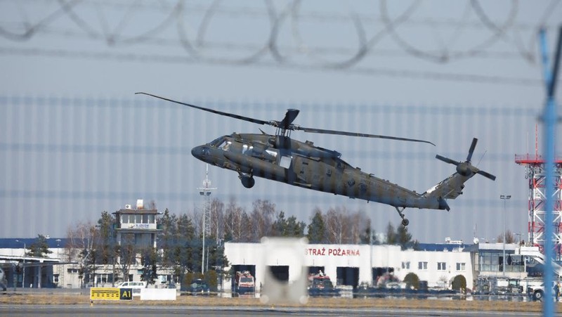 A U.S. Army Black Hawk flies over Rzeszow-Jasionka Airport ahead of U.S. President Joe Biden arrival to visit Poland, amid Russia's invasion of Ukraine, near Rzeszow, Poland, March 25, 2022. REUTERS/Kacper Pempel