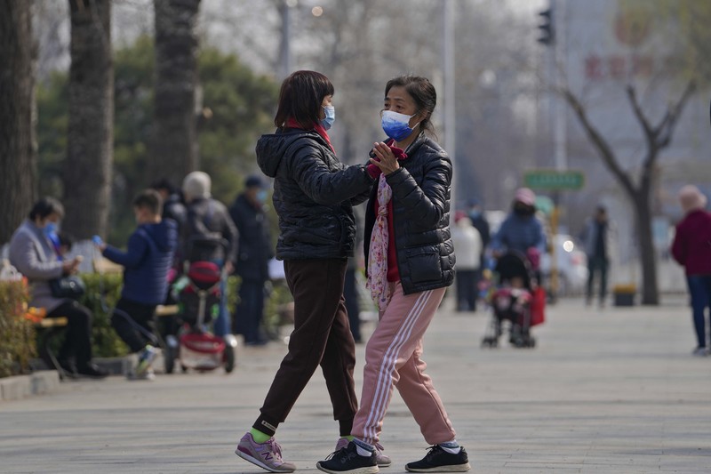 Lonjakan kasus covid-19 di China (AP/Andy Wong)