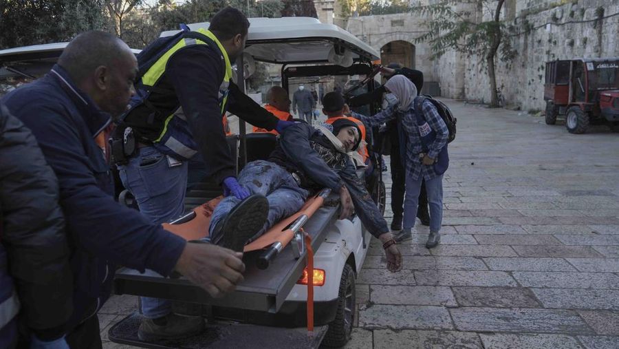Palestinians clash with Israeli security forces at the Al Aqsa Mosque compound in Jerusalem's Old City Friday, April 15, 2022. (AP Photo/Mahmoud Illean)