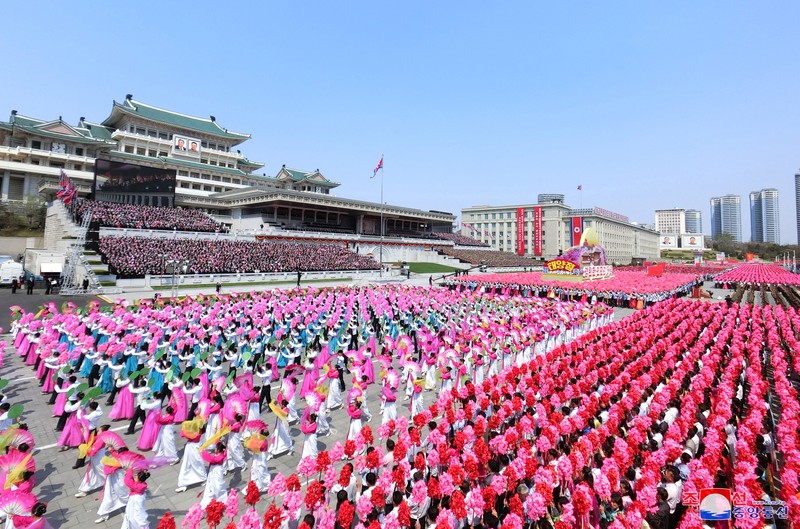 NORTHKOREA-ANNIVERSARY/ Fireworks go off in the sky as people take part in an event at Kim Il Sung Square to mark 110th birth anniversary of the state's founder, Kim II Sung, in Pyongyang, North Korea, April 15, 2022. Picture taken April 15, 2022 by North Korea's Korean Central News Agency (KCNA). KCNA via REUTERS ATTENTION EDITORS - THIS IMAGE WAS PROVIDED BY A THIRD PARTY. REUTERS IS UNABLE TO INDEPENDENTLY VERIFY THIS IMAGE. NO THIRD PARTY SALES. SOUTH KOREA OUT. NO COMMERCIAL OR EDITORIAL SALES IN SOUTH KOREA.
