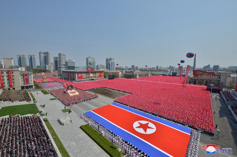 NORTHKOREA-ANNIVERSARY/ Fireworks go off in the sky as people take part in an event at Kim Il Sung Square to mark 110th birth anniversary of the state's founder, Kim II Sung, in Pyongyang, North Korea, April 15, 2022. Picture taken April 15, 2022 by North Korea's Korean Central News Agency (KCNA). KCNA via REUTERS ATTENTION EDITORS - THIS IMAGE WAS PROVIDED BY A THIRD PARTY. REUTERS IS UNABLE TO INDEPENDENTLY VERIFY THIS IMAGE. NO THIRD PARTY SALES. SOUTH KOREA OUT. NO COMMERCIAL OR EDITORIAL SALES IN SOUTH KOREA.