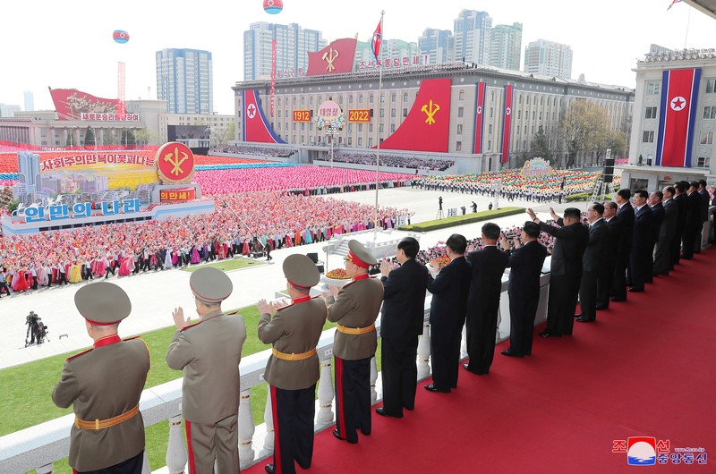 NORTHKOREA-ANNIVERSARY/ Fireworks go off in the sky as people take part in an event at Kim Il Sung Square to mark 110th birth anniversary of the state's founder, Kim II Sung, in Pyongyang, North Korea, April 15, 2022. Picture taken April 15, 2022 by North Korea's Korean Central News Agency (KCNA). KCNA via REUTERS ATTENTION EDITORS - THIS IMAGE WAS PROVIDED BY A THIRD PARTY. REUTERS IS UNABLE TO INDEPENDENTLY VERIFY THIS IMAGE. NO THIRD PARTY SALES. SOUTH KOREA OUT. NO COMMERCIAL OR EDITORIAL SALES IN SOUTH KOREA.