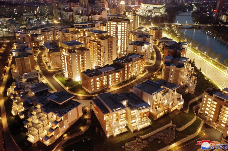 NORTHKOREA-APARTMENTS/ North Korean leader Kim Jong Un attends a tape-cutting ceremony to mark the completion of a terraced residential district on a bank of the Pothong River in Pyongyang, North Korea, April 13, 2022. Picture taken April 13, 2022 by North Korea's Korean Central News Agency (KCNA). KCNA via REUTERS ATTENTION EDITORS - THIS IMAGE WAS PROVIDED BY A THIRD PARTY. REUTERS IS UNABLE TO INDEPENDENTLY VERIFY THIS IMAGE. NO THIRD PARTY SALES. SOUTH KOREA OUT. NO COMMERCIAL OR EDITORIAL SALES IN SOUTH KOREA.