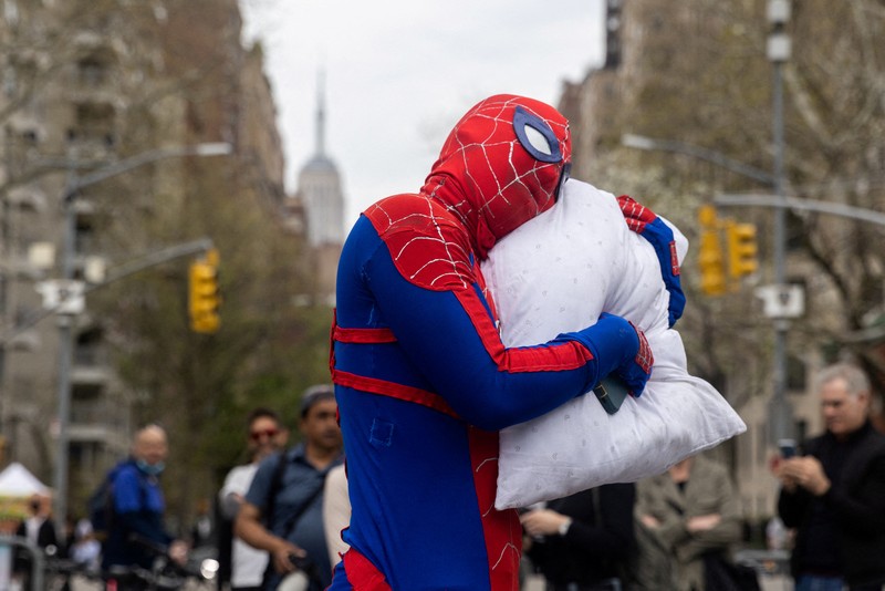 People take part in the International Pillow Fight Day at Washington Square Park in Manhattan, New York, U.S., April 16, 2022. REUTERS/Jeenah Moon