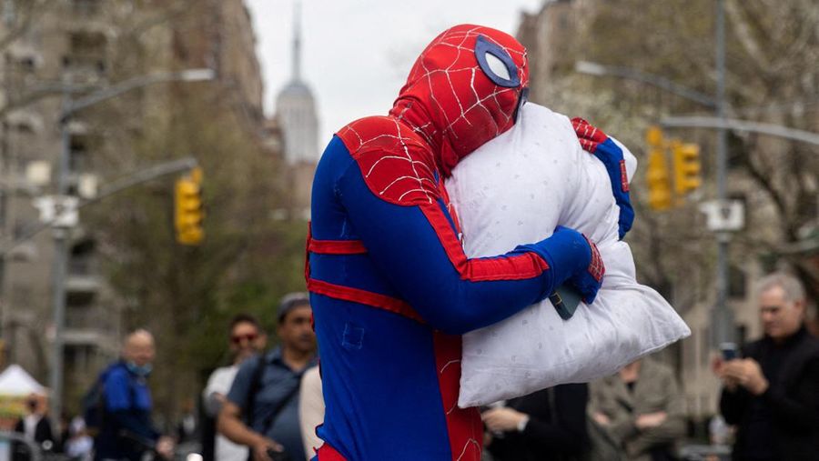People take part in the International Pillow Fight Day at Washington Square Park in Manhattan, New York, U.S., April 16, 2022. REUTERS/Jeenah Moon