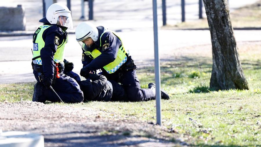 People walk during a riot ahead of a demonstration planned by Danish anti-Muslim politician Rasmus Paludan and his Stram Kurs party, which was to include a burning of the Muslim holy book Koran, in Navestad, Norrkoping, Sweden April 17, 2022, in this handout image obtained by Reuters on April 17, 2022.       Ulf Wigh/Wighsnews/Handout via REUTERS    THIS IMAGE HAS BEEN SUPPLIED BY A THIRD PARTY. MANDATORY CREDIT.