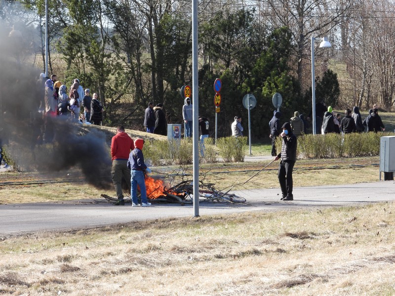People walk during a riot ahead of a demonstration planned by Danish anti-Muslim politician Rasmus Paludan and his Stram Kurs party, which was to include a burning of the Muslim holy book Koran, in Navestad, Norrkoping, Sweden April 17, 2022, in this handout image obtained by Reuters on April 17, 2022.       Ulf Wigh/Wighsnews/Handout via REUTERS    THIS IMAGE HAS BEEN SUPPLIED BY A THIRD PARTY. MANDATORY CREDIT.
