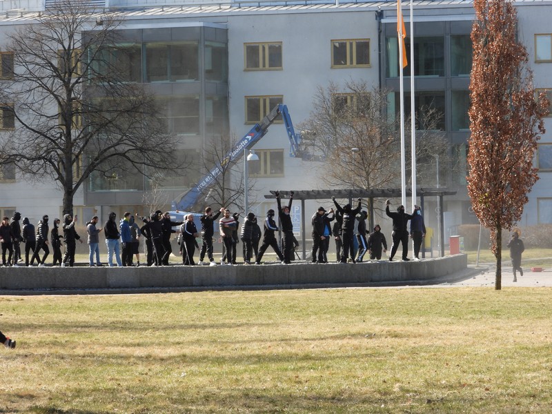 People walk during a riot ahead of a demonstration planned by Danish anti-Muslim politician Rasmus Paludan and his Stram Kurs party, which was to include a burning of the Muslim holy book Koran, in Navestad, Norrkoping, Sweden April 17, 2022, in this handout image obtained by Reuters on April 17, 2022.       Ulf Wigh/Wighsnews/Handout via REUTERS    THIS IMAGE HAS BEEN SUPPLIED BY A THIRD PARTY. MANDATORY CREDIT.