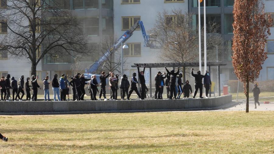 People walk during a riot ahead of a demonstration planned by Danish anti-Muslim politician Rasmus Paludan and his Stram Kurs party, which was to include a burning of the Muslim holy book Koran, in Navestad, Norrkoping, Sweden April 17, 2022, in this handout image obtained by Reuters on April 17, 2022.       Ulf Wigh/Wighsnews/Handout via REUTERS    THIS IMAGE HAS BEEN SUPPLIED BY A THIRD PARTY. MANDATORY CREDIT.