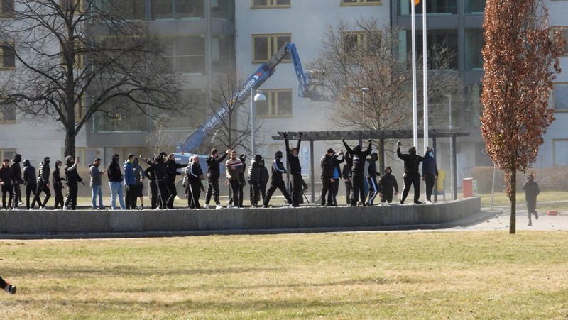 People walk during a riot ahead of a demonstration planned by Danish anti-Muslim politician Rasmus Paludan and his Stram Kurs party, which was to include a burning of the Muslim holy book Koran, in Navestad, Norrkoping, Sweden April 17, 2022, in this handout image obtained by Reuters on April 17, 2022.       Ulf Wigh/Wighsnews/Handout via REUTERS    THIS IMAGE HAS BEEN SUPPLIED BY A THIRD PARTY. MANDATORY CREDIT.