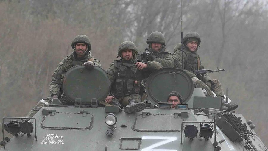 Service members of pro-Russian troops drive an armoured vehicle during Ukraine-Russia conflict near the southern port city of Mariupol, Ukraine April 17, 2022. REUTERS/Alexander Ermochenko