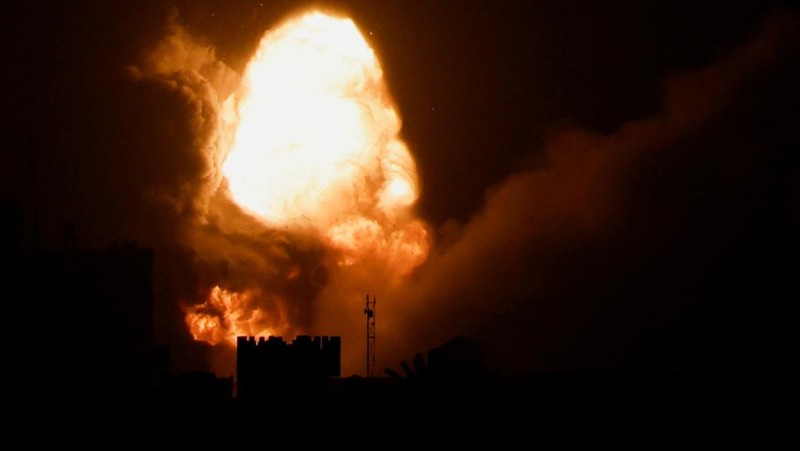 An explosion is caused by Israeli airstrikes on a Hamas military base in town of Khan Younis, southern Gaza Strip, Tuesday April 19, 2022. (AP Photo/Yousef Masoud)