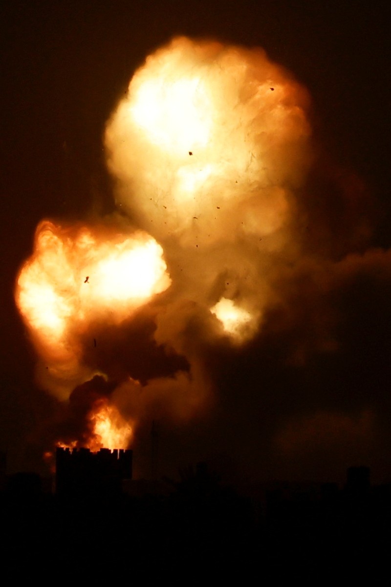 Israel Palestinians An explosion is caused by Israeli airstrikes on a Hamas military base in town of Khan Younis, southern Gaza Strip, Tuesday April 19, 2022. (AP Photo/Yousef Masoud)