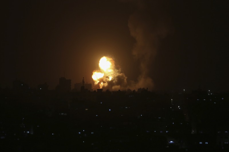 Israel Palestinians An explosion is caused by Israeli airstrikes on a Hamas military base in town of Khan Younis, southern Gaza Strip, Tuesday April 19, 2022. (AP Photo/Yousef Masoud)