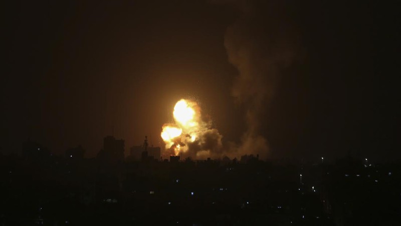 An explosion is caused by Israeli airstrikes on a Hamas military base in town of Khan Younis, southern Gaza Strip, Tuesday April 19, 2022. (AP Photo/Yousef Masoud)