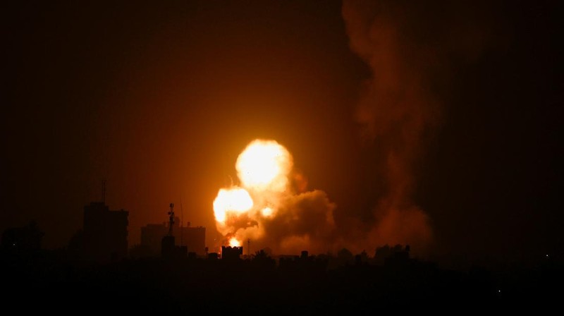 An explosion is caused by Israeli airstrikes on a Hamas military base in town of Khan Younis, southern Gaza Strip, Tuesday April 19, 2022. (AP Photo/Yousef Masoud)