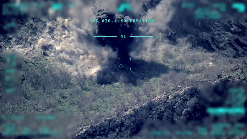 View of a target being hit during a military operation, in this still image taken from a handout video at an unknown location released on April 18, 2022. Turkish Defence Ministry/Handout via REUTERS    THIS IMAGE HAS BEEN SUPPLIED BY A THIRD PARTY  NO RESALES. NO ARCHIVES.   IMAGE WAS DIGITALLY MASKED AT SOURCE