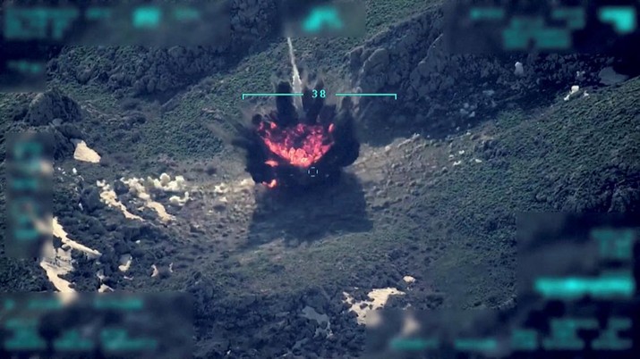 View of a target being hit during a military operation, in this still image taken from a handout video at an unknown location released on April 18, 2022. Turkish Defence Ministry/Handout via REUTERS    THIS IMAGE HAS BEEN SUPPLIED BY A THIRD PARTY  NO RESALES. NO ARCHIVES.   IMAGE WAS DIGITALLY MASKED AT SOURCE