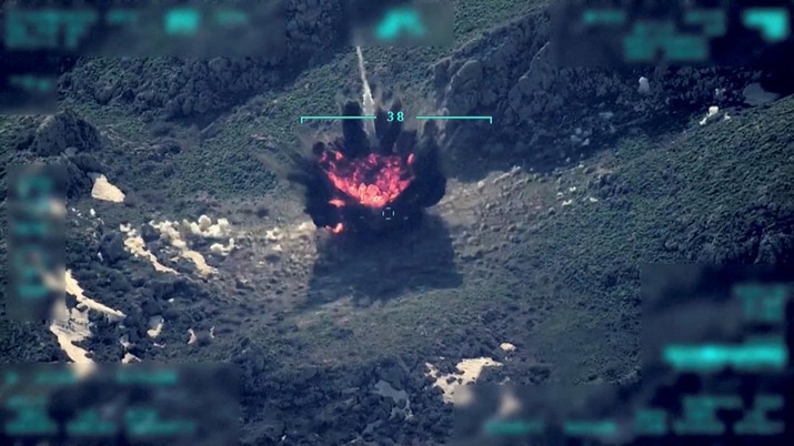 TURKEY-IRAQ/ View of a target being hit during a military operation, in this still image taken from a handout video at an unknown location released on April 18, 2022. Turkish Defence Ministry/Handout via REUTERS THIS IMAGE HAS BEEN SUPPLIED BY A THIRD PARTY NO RESALES. NO ARCHIVES. IMAGE WAS DIGITALLY MASKED AT SOURCE