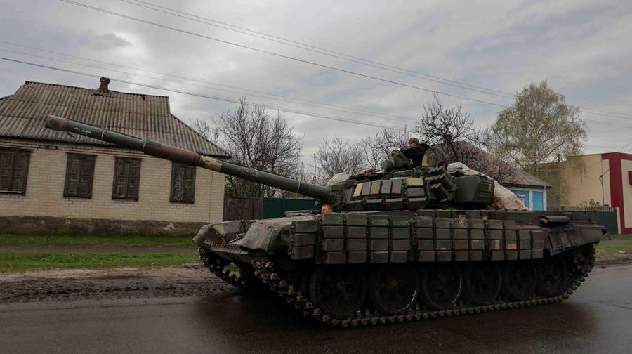 Tanks of Ukrainian Armed Forces ride along a street in a village, as Russia's attack on Ukraine continues, in Donetsk Region, Ukraine April 18, 2022.  REUTERS/Serhii Nuzhnenko