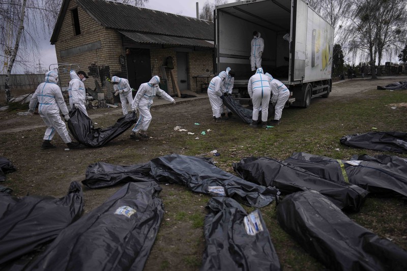 Russia Ukraine War A general view of the cemetery in Irpin where three dug graves await the next funerals on Tuesday, April 19, 2022, in the outskirts of Kyiv. (AP Photo/Emilio Morenatti)