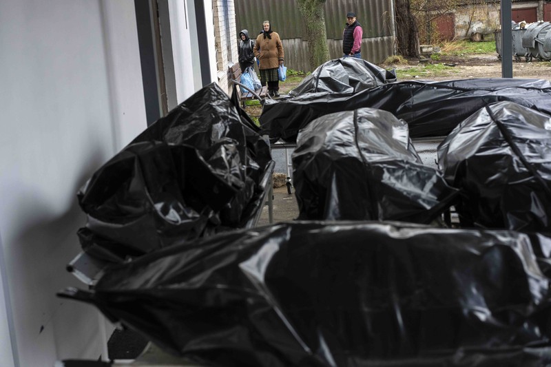 Russia Ukraine War A general view of the cemetery in Irpin where three dug graves await the next funerals on Tuesday, April 19, 2022, in the outskirts of Kyiv. (AP Photo/Emilio Morenatti)