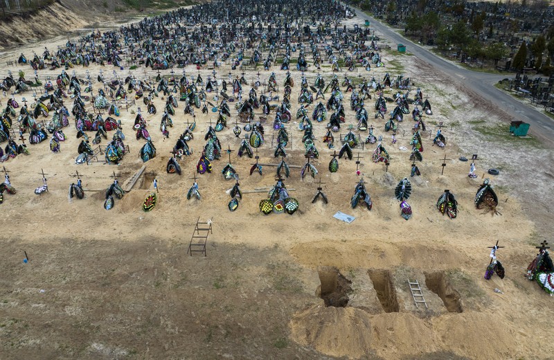 Russia Ukraine War A general view of the cemetery in Irpin where three dug graves await the next funerals on Tuesday, April 19, 2022, in the outskirts of Kyiv. (AP Photo/Emilio Morenatti)