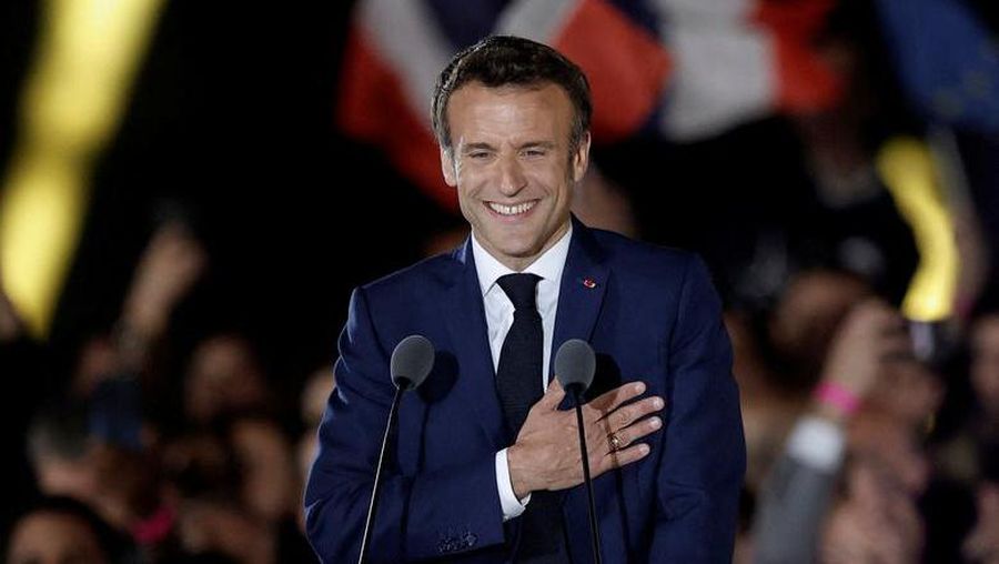 French President Emmanuel Macron gestures as he arrives to deliver a speech after being re-elected as president, following the results in the second round of the 2022 French presidential election, during his victory rally at the Champs de Mars in Paris, April 24. REUTERS/Benoit Tessier