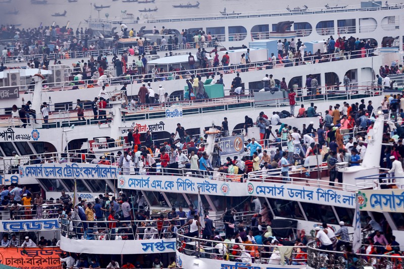 People sit onboard passenger ferries to travel home to celebrate Eid al-fitr, at the Sadarghat Launch Terminal, in Dhaka, Bangladesh, April 30, 2022. REUTERS/Mohammad Ponir Hossain
