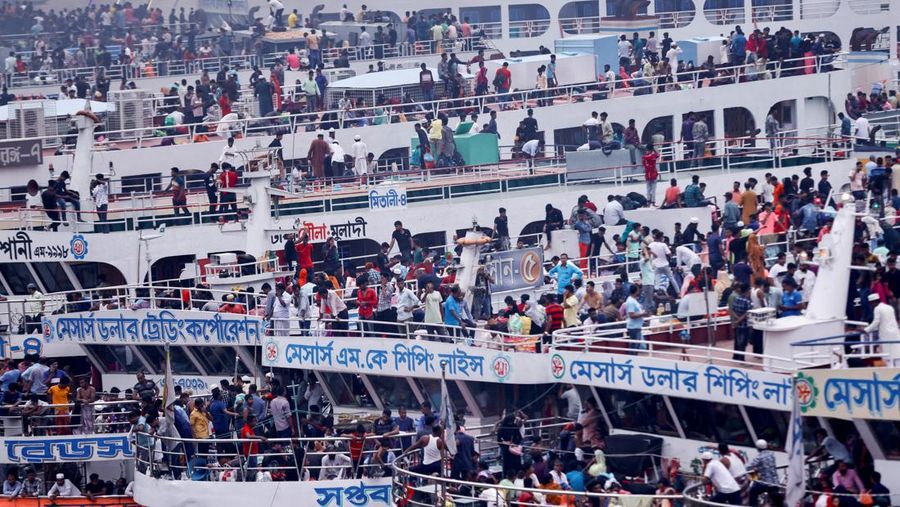 People sit onboard passenger ferries to travel home to celebrate Eid al-fitr, at the Sadarghat Launch Terminal, in Dhaka, Bangladesh, April 30, 2022. REUTERS/Mohammad Ponir Hossain