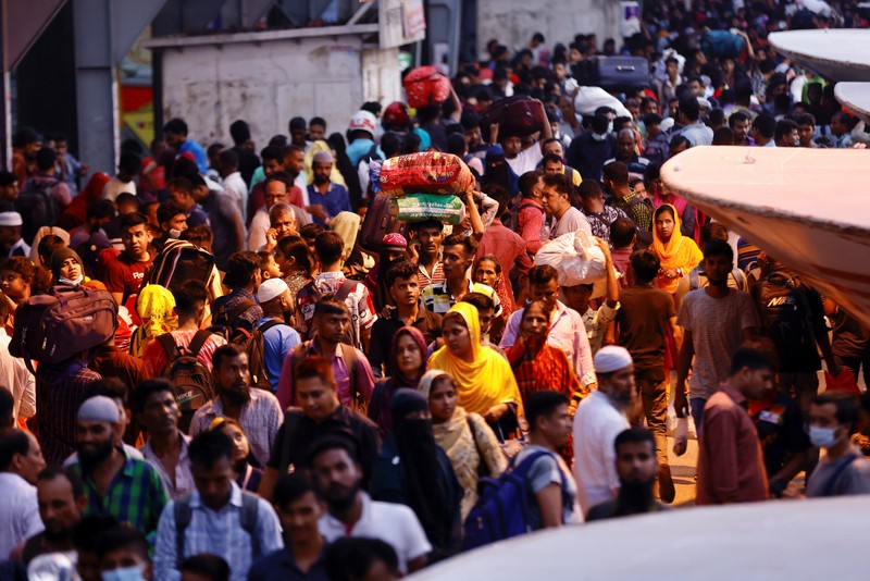 RELIGION-EID/BANGLADESH People sit onboard passenger ferries to travel home to celebrate Eid al-fitr, at the Sadarghat Launch Terminal, in Dhaka, Bangladesh, April 30, 2022. REUTERS/Mohammad Ponir Hossain