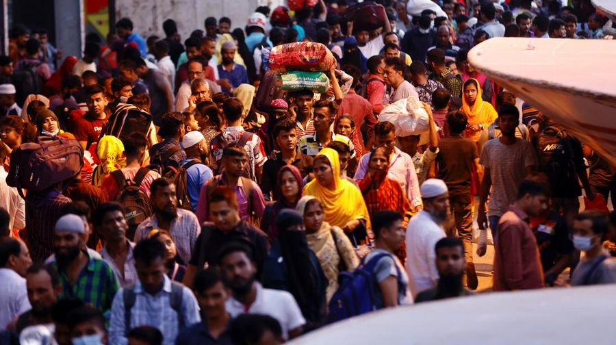 People gather to get onboard passenger ferries to travel home to celebrate Eid al-Fitr, at the Sadarghat Launch Terminal, in Dhaka, Bangladesh, April 30, 2022. REUTERS/Mohammad Ponir Hossain