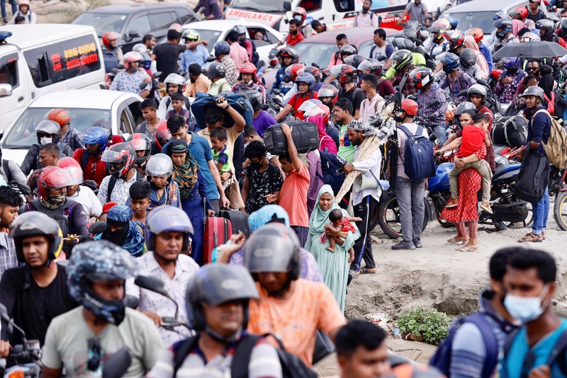 RELIGION-EID/BANGLADESH People sit onboard passenger ferries to travel home to celebrate Eid al-fitr, at the Sadarghat Launch Terminal, in Dhaka, Bangladesh, April 30, 2022. REUTERS/Mohammad Ponir Hossain