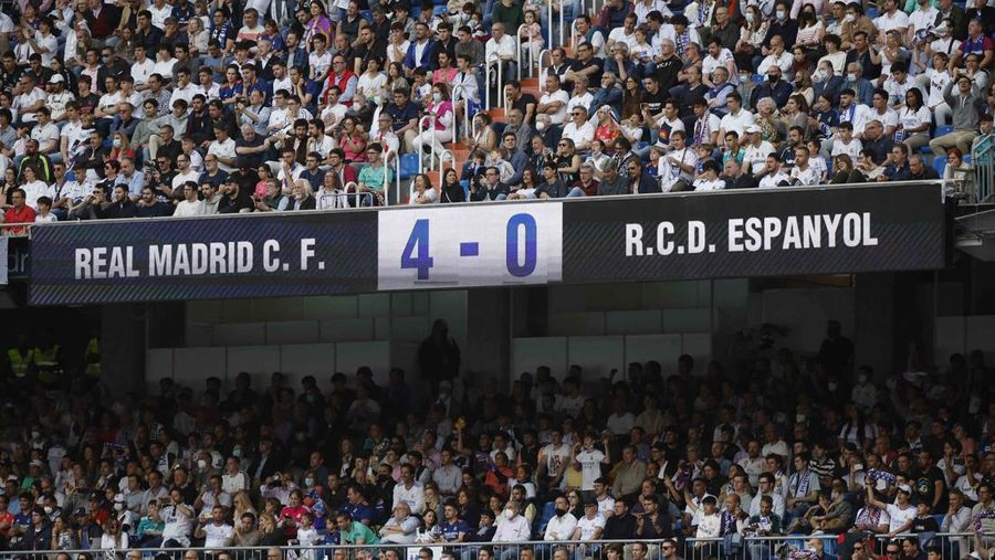 Soccer Football - LaLiga - Real Madrid v Espanyol - Santiago Bernabeu, Madrid, Spain - April 30, 2022 Real Madrid team members celebrate with the trophy after winning LaLiga REUTERS/Susana Vera