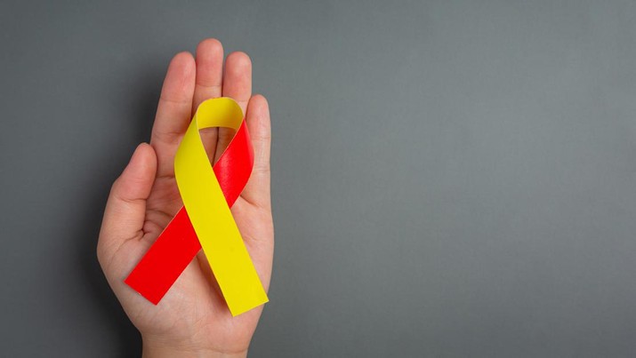 World hepatitis day awareness with red yellow ribbon. Ilustrasi Hepatitis (photo created by jcomp via Freepik)