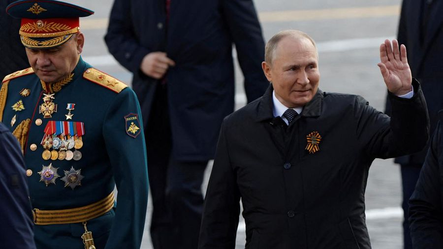 Russian President Vladimir Putin and Defence Minister Sergei Shoigu walk after a military parade on Victory Day, which marks the 77th anniversary of the victory over Nazi Germany in World War Two, in Red Square in central Moscow, Russia May 9, 2022. REUTERS/Maxim Shemetov