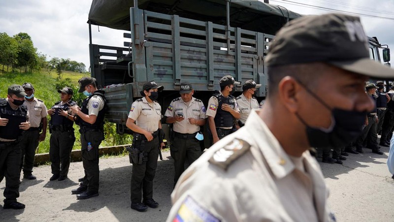 Soldiers patrol outside Bellavista prison where a deadly riot broke out overnight in Santo Domingo de los Tsachilas, Ecuador, Monday, May 9, 2022. (AP Photo/Dolores Ochoa)