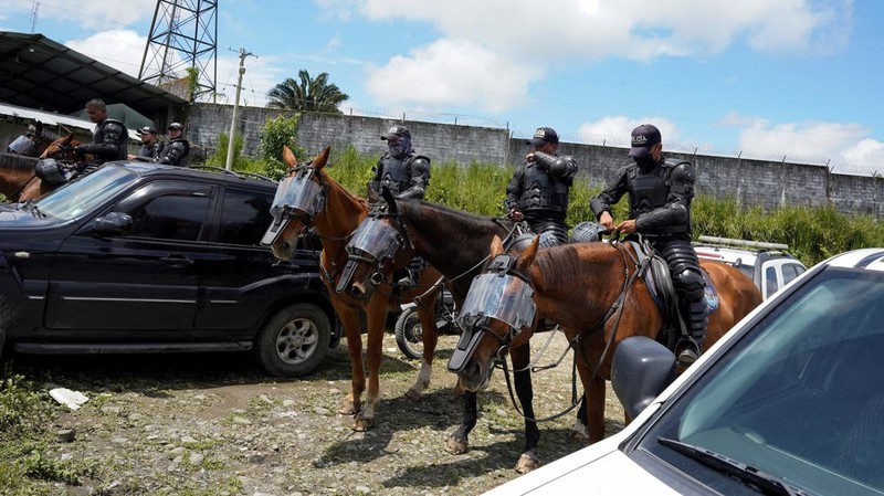 Soldiers patrol outside Bellavista prison where a deadly riot broke out overnight in Santo Domingo de los Tsachilas, Ecuador, Monday, May 9, 2022. (AP Photo/Dolores Ochoa)